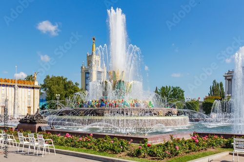 Stone Flower Fountain in VDNH park in Moscow against blue sky at sunny summer day. Exhibition of Achievements of National Economy is russian popular touristic landmark