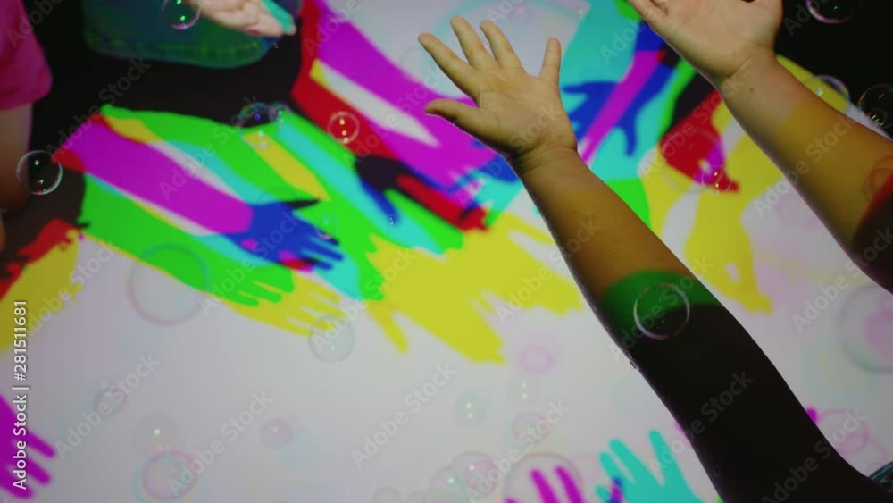 colorful hands popping bubbles children having fun playing with multicolor light kids playing game with rainbow colors happy childhood concept 4k colorful hands popping bubbles children having fun playing with multicolor light kids playing game with rainbow colors happy childhood concept 4k