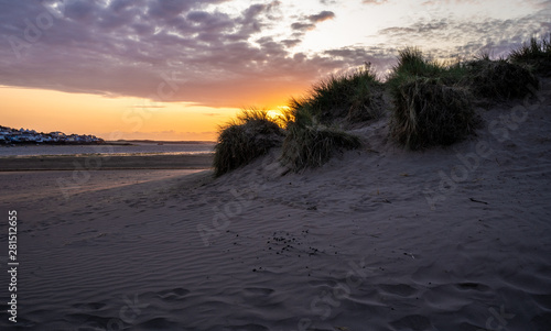 Instow, Devon - July 27 2019: Sunset over the Sand Dunes at the Beach photo