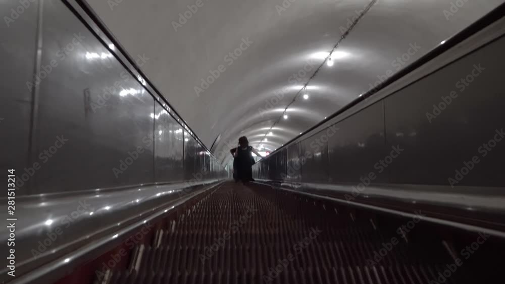 Descent on the escalator in the subway. the staircase moves down Georgia, Tbilisi. Descent on the escalator in the subway. the staircase moves down Georgia, Tbilisi.