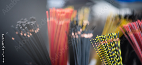 Bundle of copper cables with protect layer. Cables cut to established length and removed insulation. Ready to making electrical contacts and connections. Theme of production and industry. Banner forma