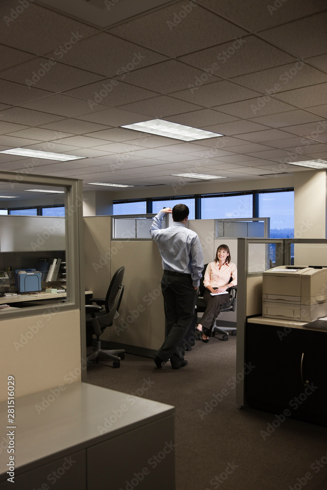 Business people talking to each other in office Business people talking to each other in office