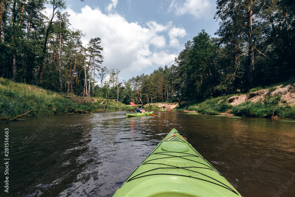 Fototapeta premium A people kayaking down the river.