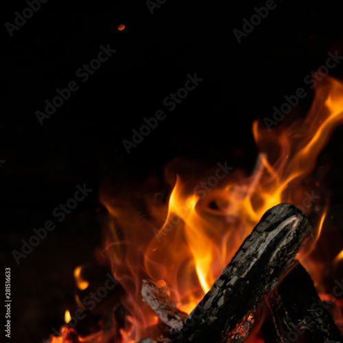 fire flames in bonfire stove isolated with balck