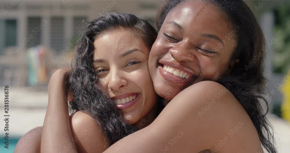 two beautiful women best friends having fun on sunny day playful girls hugging enjoying summer relaxing together by swimming pool summertime friendship 4k