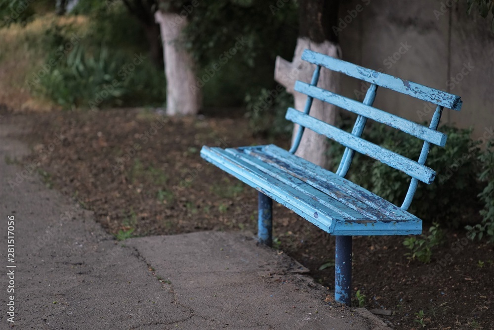 old shabby blue bench in the countryside old shabby blue bench in the countryside
