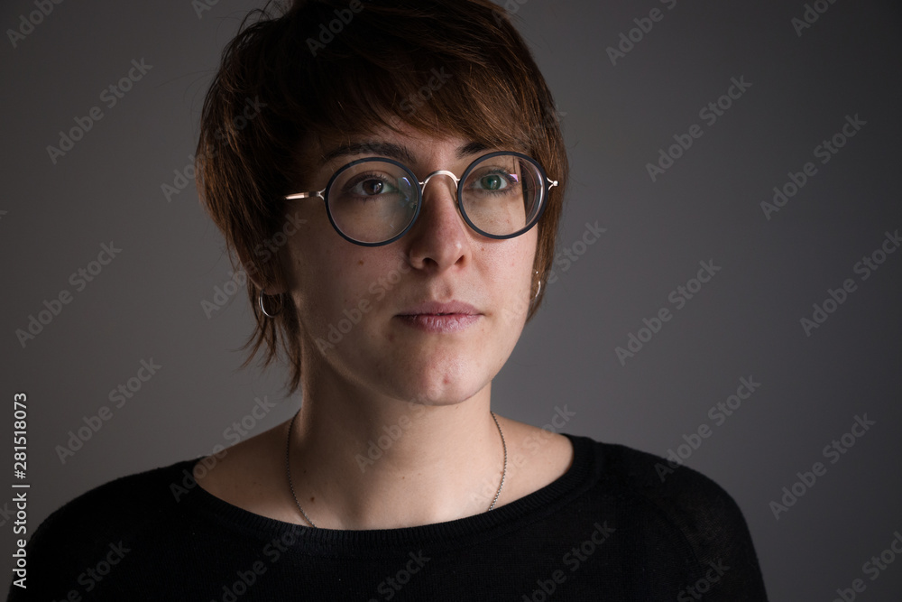Fototapeta premium Portrait of girl with brown short hair looking ahead