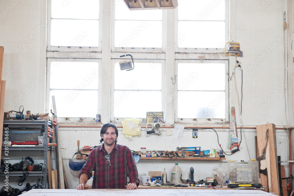 Portrait of carpenter standing in workshop Portrait of carpenter standing in workshop
