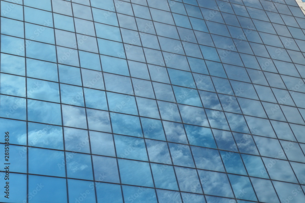 Windows of modern skyscraper with mirrored sky Windows of modern skyscraper with mirrored sky