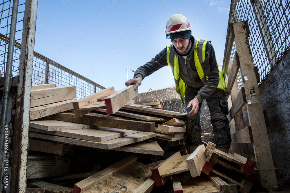 Worker in protective workwear working outdoors Worker in protective workwear working outdoors
