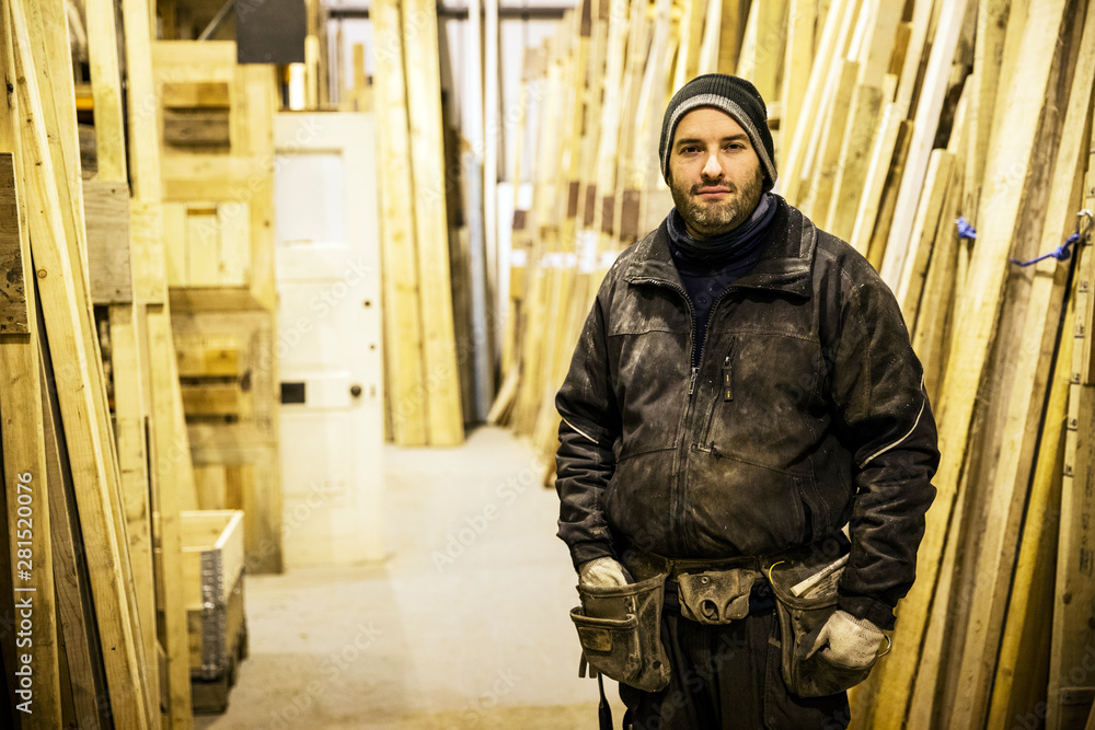 Portrait of worker standing in warehouse Portrait of worker standing in warehouse