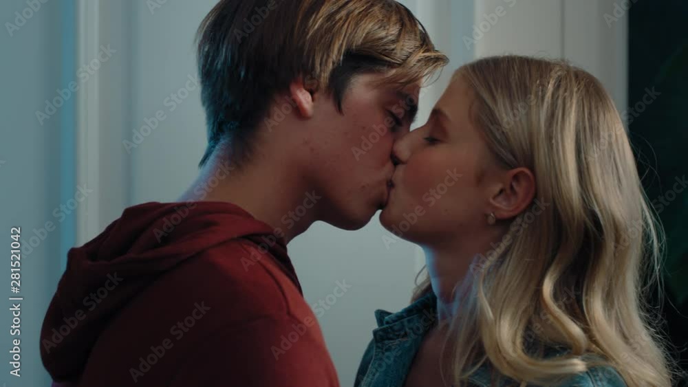 happy teenage couple first kiss girl kissing boyfriend at home after romantic evening date together 4k happy teenage couple first kiss girl kissing boyfriend at home after romantic evening date together 4k
