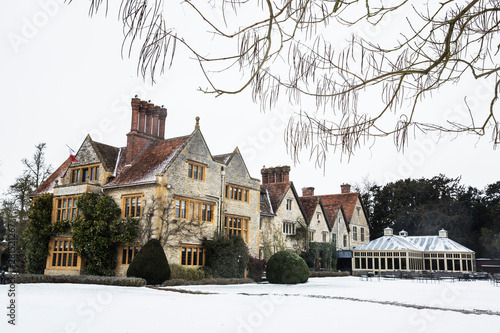 Exterior view of 17th century manor house with tall chimneys photo