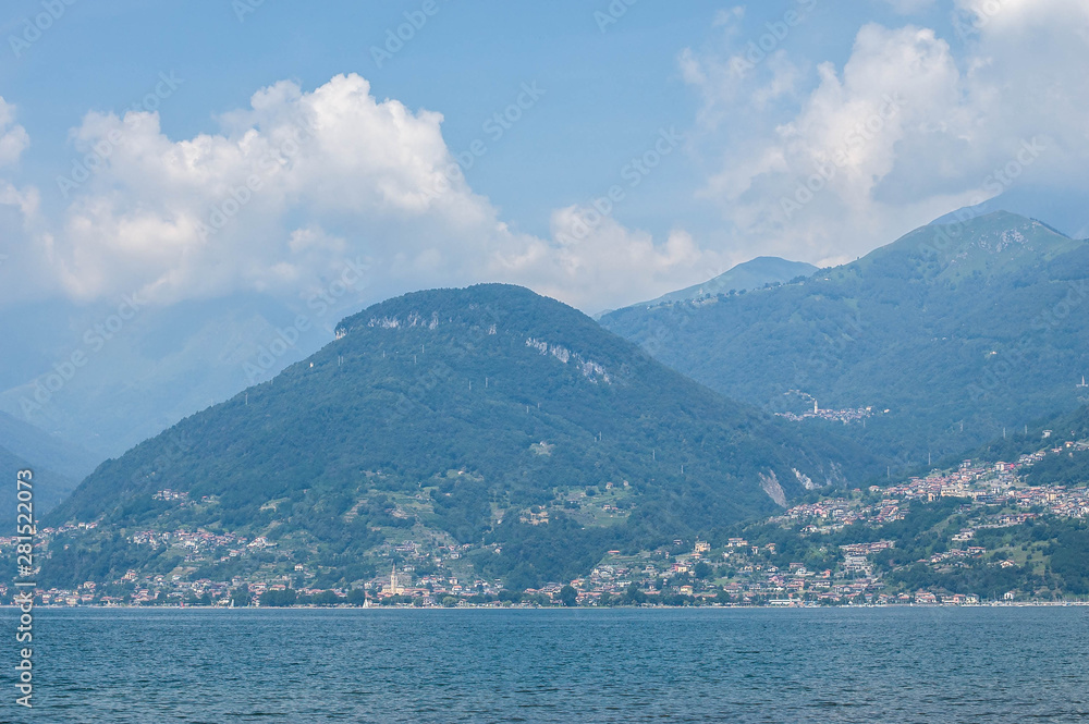 View of mountain lake on a sunny summer day. District of Como Lake, Colico, Italy, Europe