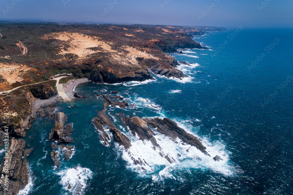 Scenic aerial view of the Lapa das Pombas fishing harbour near the Almograve beach, in Alentejo, Portugal; Concept for travel in Portugal