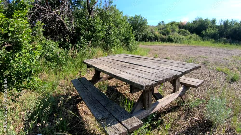 Sitting bench in the park on a sunny day. ( 4k footage ) Sitting bench in the park on a sunny day. ( 4k footage )