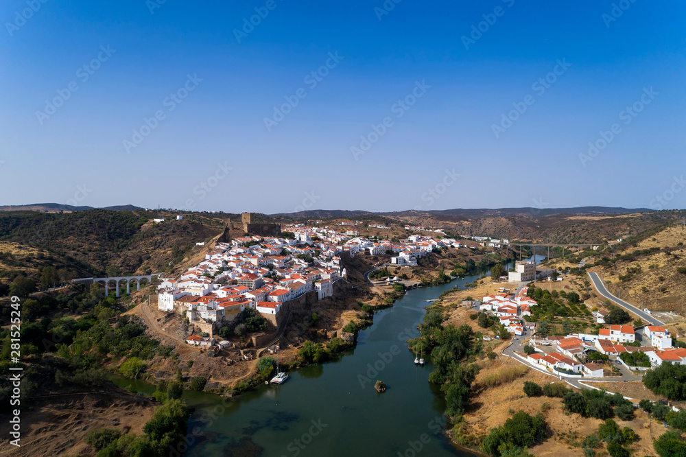 Aerial view of the beautiful village of Mértola in Alentejo, Portugal; Concept for travel in Portugal and Portuguese historical villages.