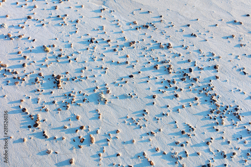 High angle view of rocks on snowy landscape photo