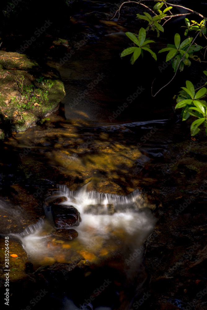 Multiple exposure of the stream of a river in the highlands of the Andean mountains of central Colombia.