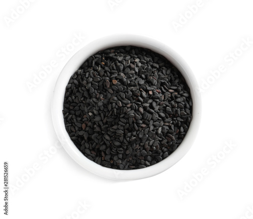 Black sesame seeds in bowl on white background, top view. Delicious sauce condiment