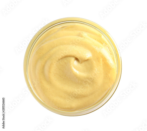 Delicious mustard in bowl on white background, top view. Spicy sauce