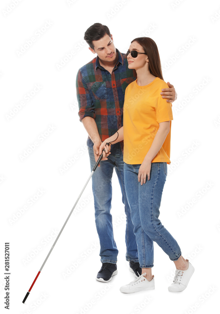 Man assisting blind woman with long cane on white background Man assisting blind woman with long cane on white background