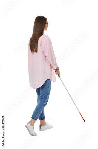 Blind woman with long cane on white background