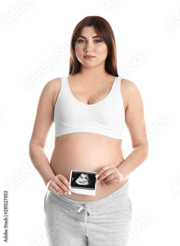 Pregnant woman with ultrasound picture on white background