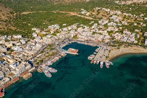 ELOUNDA, CRETE, GREECE - 13 JULY 2019: Aerial view of the up market town of Elounda on the greek island of Crete