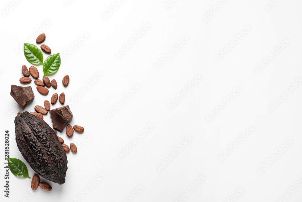 Obraz premium Cocoa pod with beans and chocolate pieces on white background, top view