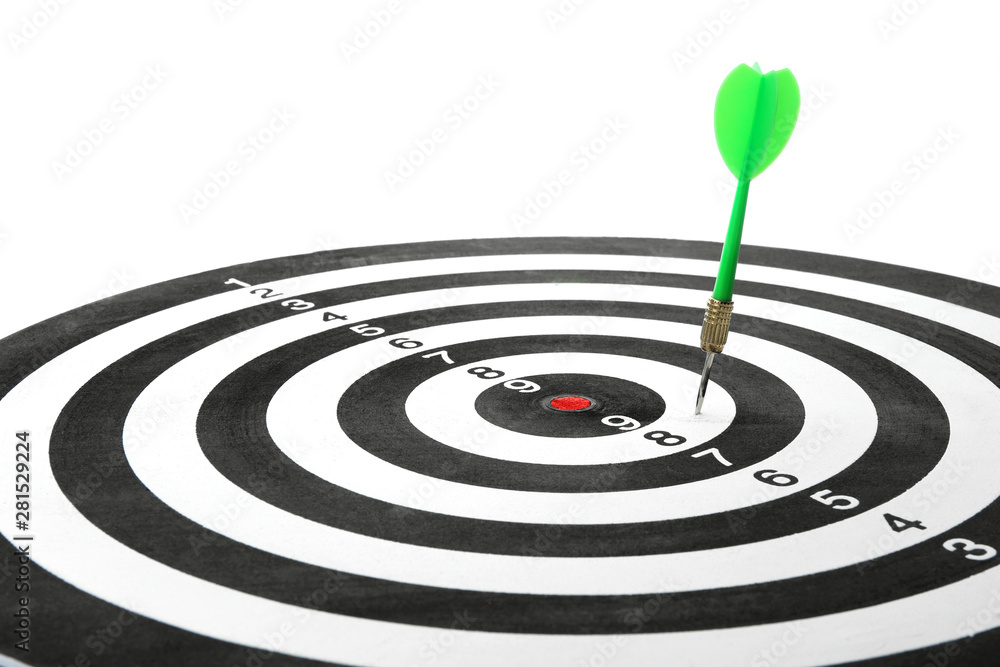 Dart board with color arrow hitting target, closeup Dart board with color arrow hitting target, closeup