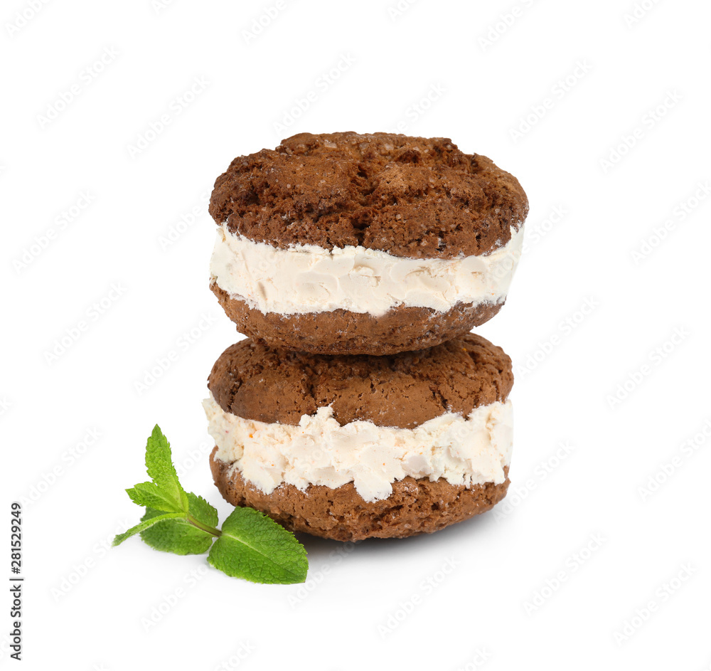 Sweet delicious ice cream cookie sandwiches and mint on white background Sweet delicious ice cream cookie sandwiches and mint on white background