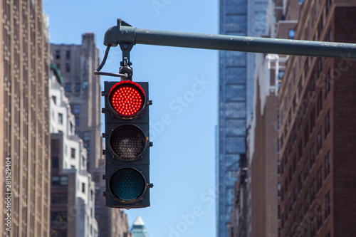 Traffic light on the background of skyscrapers in New York photo