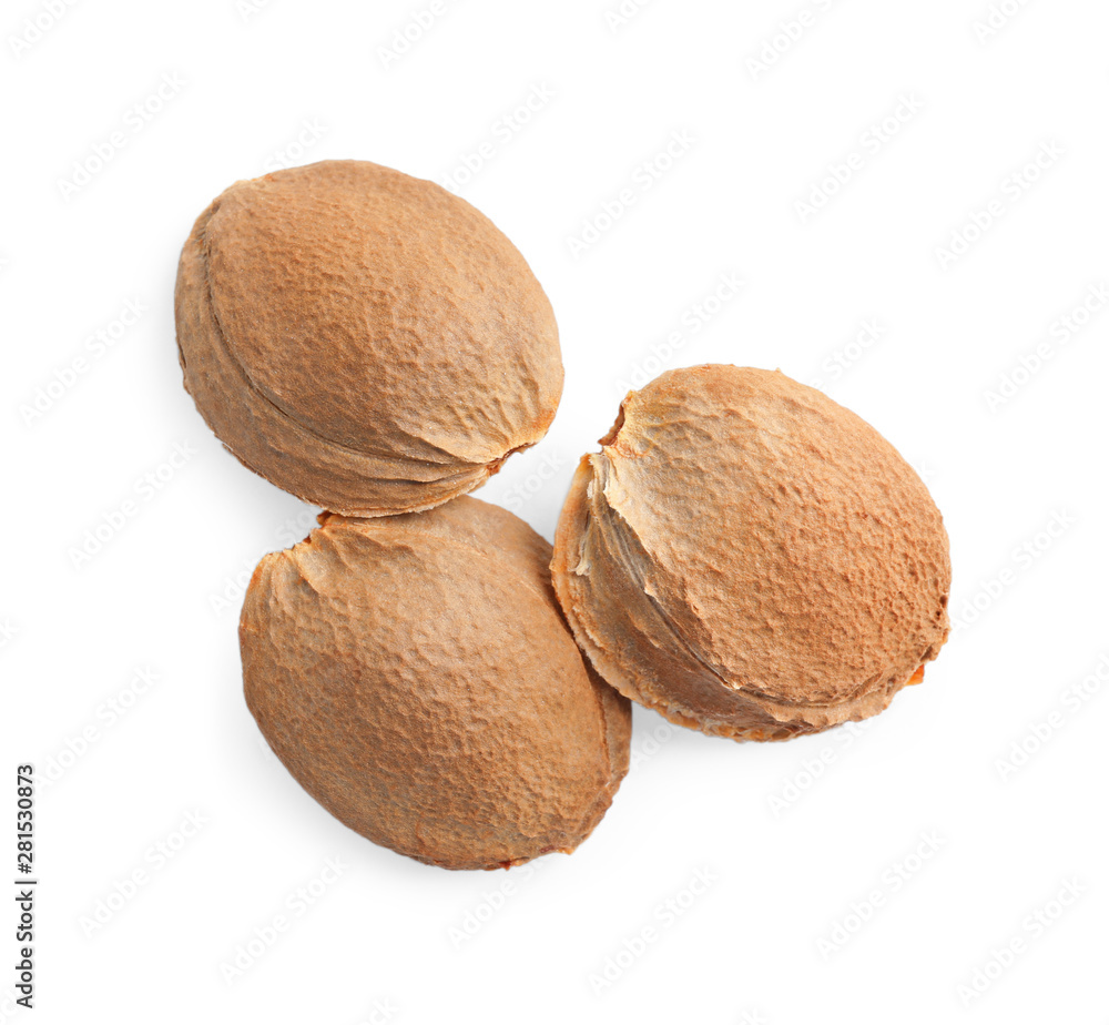Organic dried apricot kernels on white background, top view Organic dried apricot kernels on white background, top view