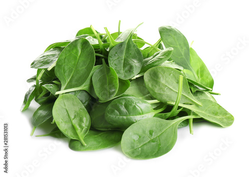 Pile of fresh green healthy baby spinach leaves on white background