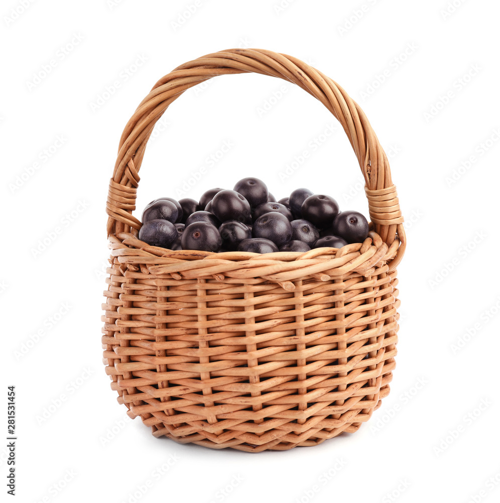 Wicker basket with fresh acai berries on white background Wicker basket with fresh acai berries on white background