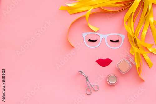 Make up concept with face model for visagiste work on pink background top view mockup photo