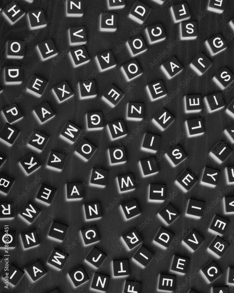 Overhead view of blocks of scattered letters Overhead view of blocks of scattered letters
