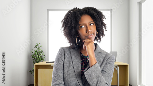 Obraz na plátne Black African American businesswoman in an office thinking of ideas