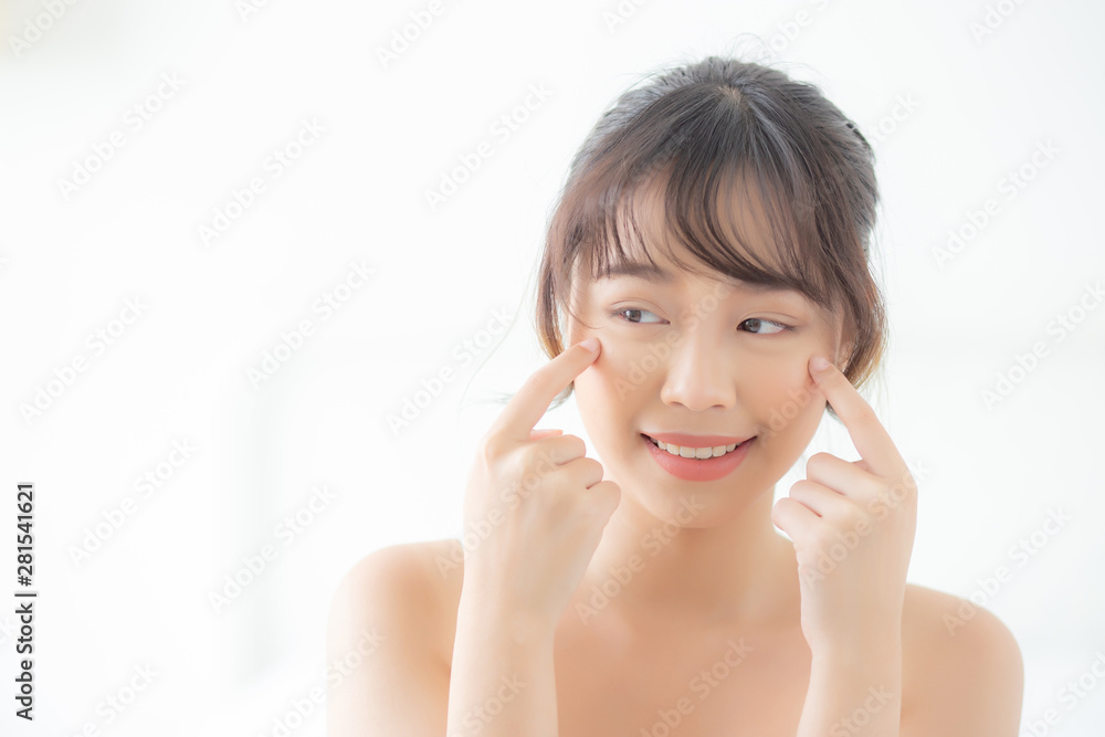 Portrait of beautiful young asian woman smile healthy and wellness at the bedroom, beauty asia girl skin care touch eye makup and cosmetic with happy with fresh, lifestyle and relax concept. Portrait of beautiful young asian woman smile healthy and wellness at the bedroom, beauty asia girl skin care touch eye makup and cosmetic with happy with fresh, lifestyle and relax concept.