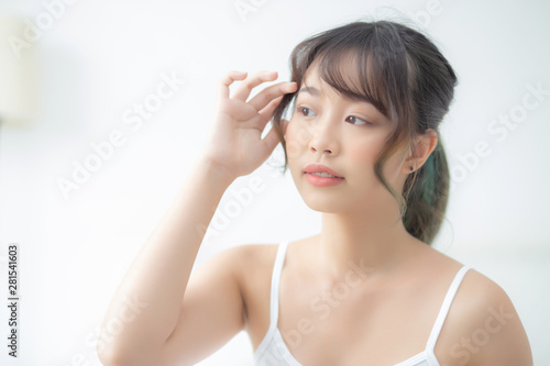 Wallpaper Mural Portrait of beautiful young asian woman smile while wake up healthy and wellness with sunrise at morning in the bedroom, asia girl skin care with happy with fresh, lifestyle and relax concept. Torontodigital.ca