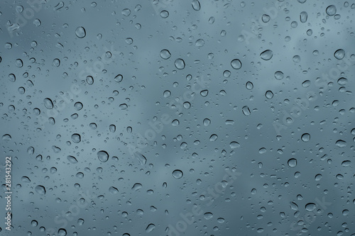 Raindrops on the window close up. rain drops on the glass macro. water drops falling down on window. rainy day
