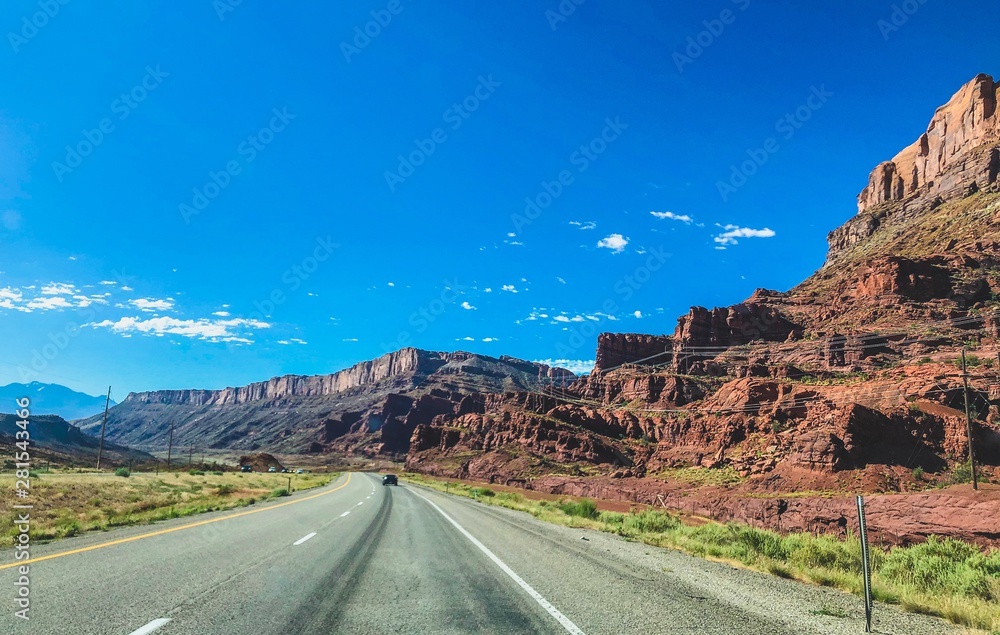 road next to red cliffs