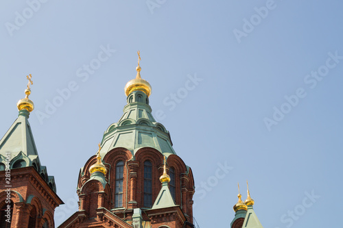 Beautiful old church tower with the cross photo