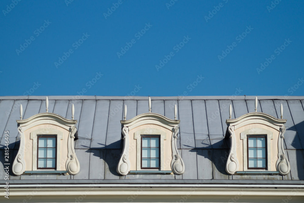 Roof with windows. attic of the house with the sky