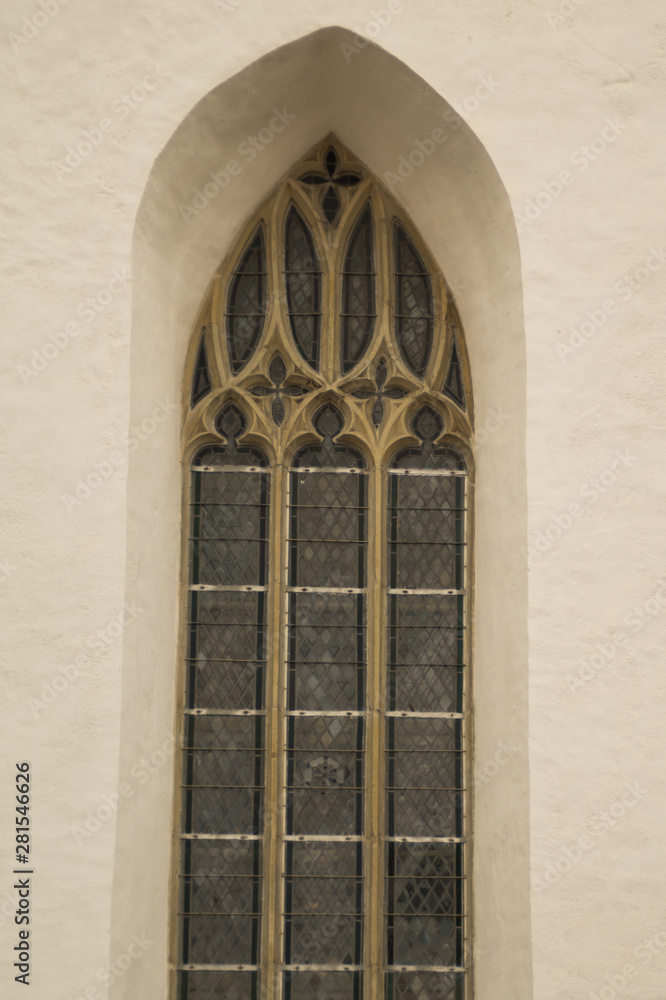 Unusual window on the facade of the old house Unusual window on the facade of the old house