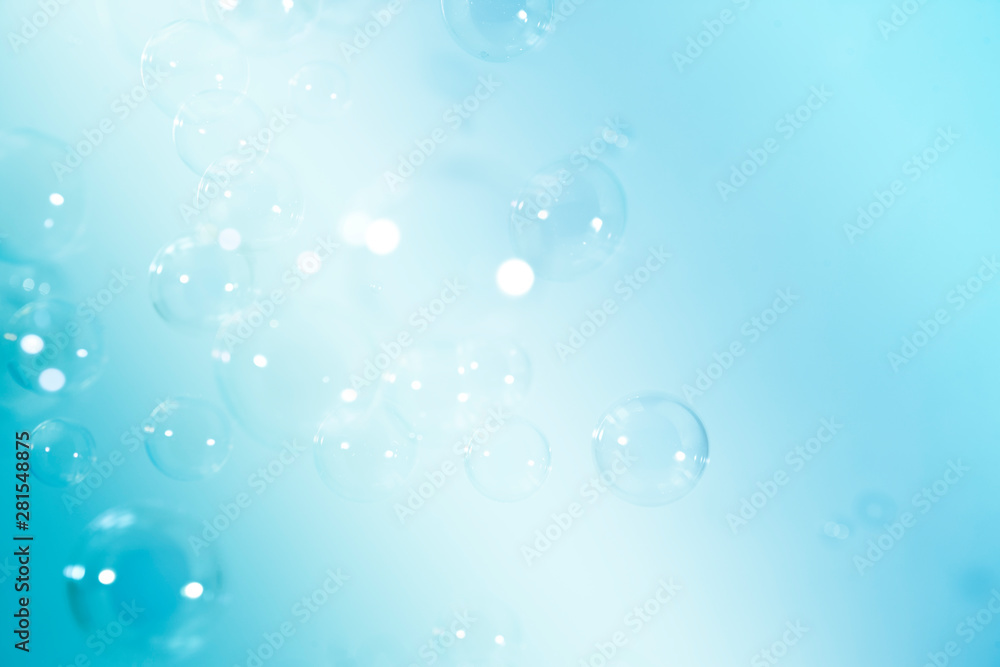 soap bubbles floating on a blue background