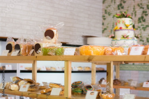 pastry shop display at wooden shelve, cookies showcase. photo