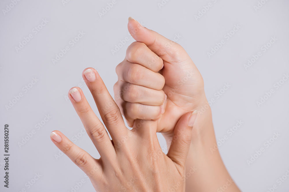 Healthcare and medical concept. Woman massaging her painful Index finger. Healthcare and medical concept. Woman massaging her painful Index finger.