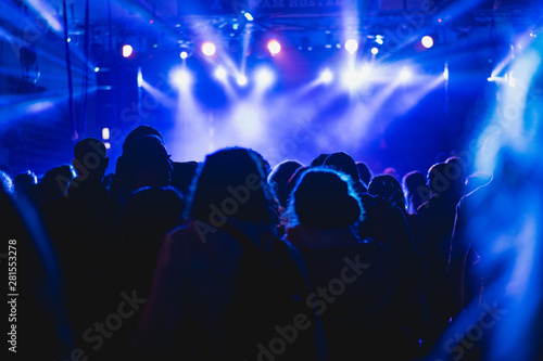 Tel Aviv, Israel February 23, 2018: Blue lights at a concert with people in the foreground © Dan